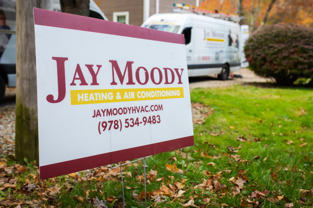 Jay Moody HVAC sign outside Massachusetts homes 