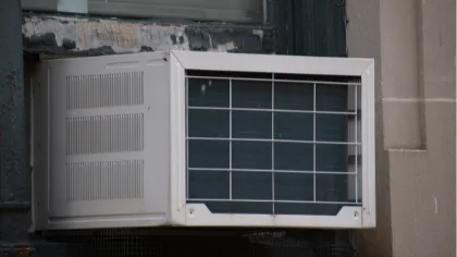 Window air conditioning system positioned in a home window.