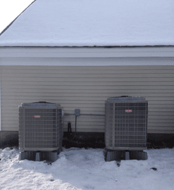 Two central heat pump systems located on left side of Leominster home'sgarage.