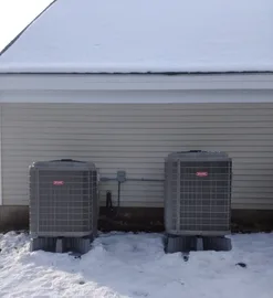 Two central heat pump systems located on left side of Leominster home'sgarage.