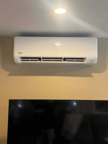 Indoor wall-mounted ductless heat pump unit installed in Manyard, Massachusetts home.