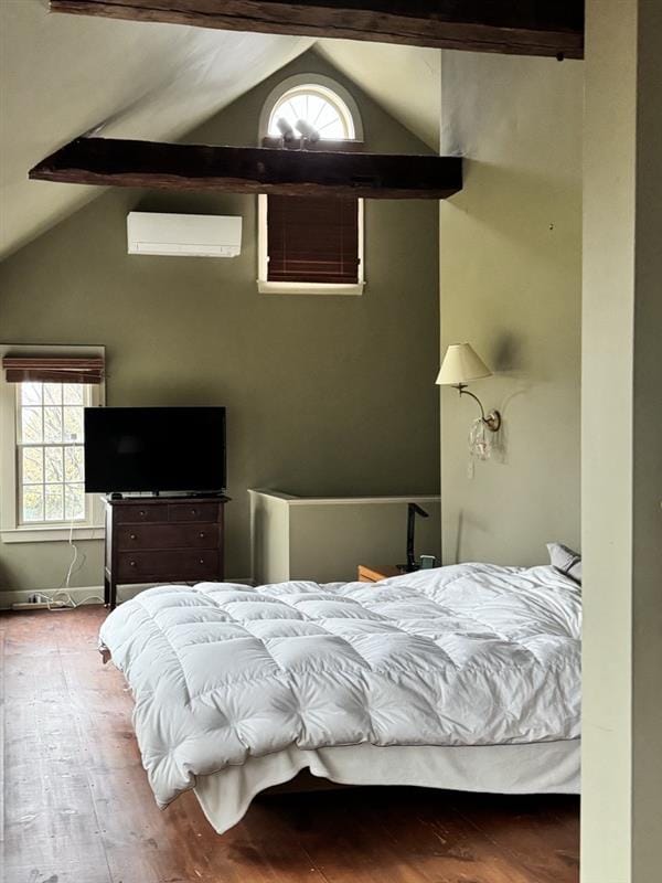 Mini-split mounted on green wall in Harvard, MA bedroom.