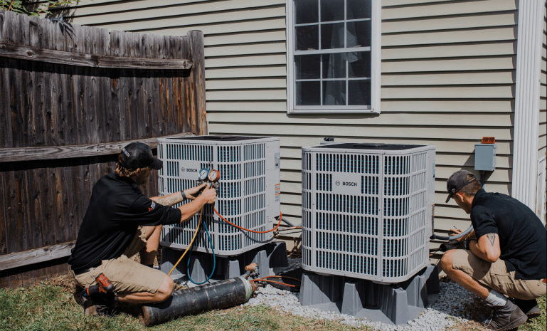 Massachusetts heat pump contractors installing heat pump HVAC system.